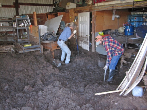 Doug tackles the mud in the barn.
