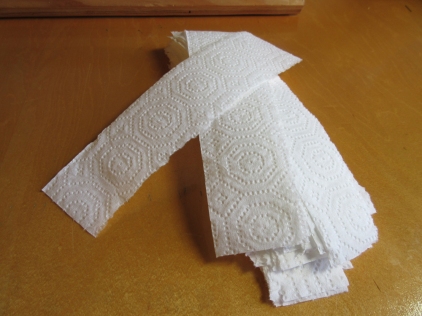 The only supplies needed for a stoma hat are one-inch-wide strips of paper towel.